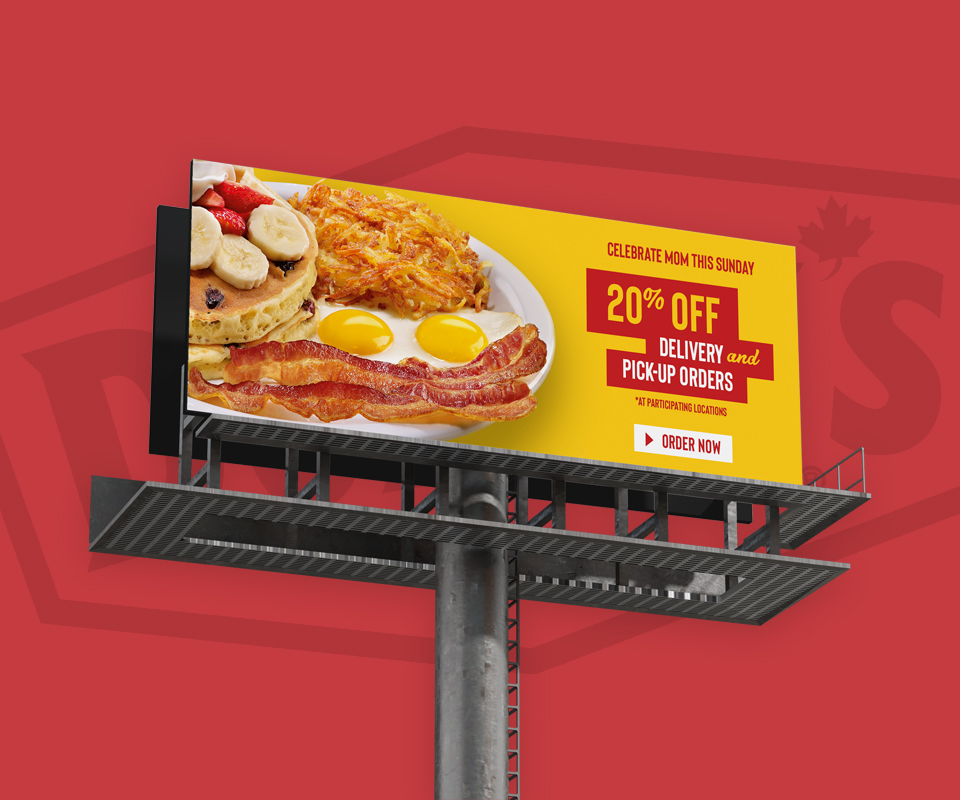 A billboard mockup showing a Denny's 20% off deal